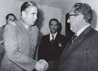 Augusto Pinochet being congratulated by his US sponsor.