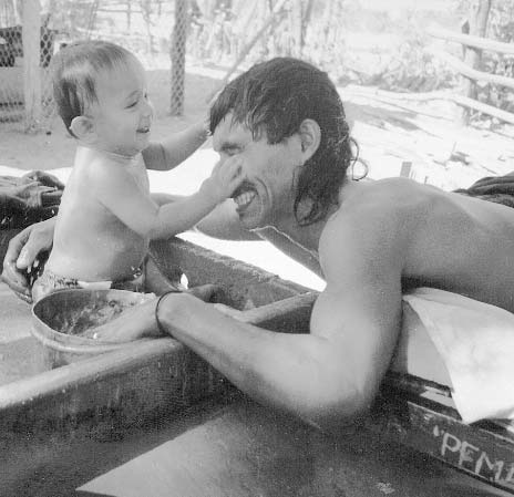Martín Pérez gives a young friend a bath
