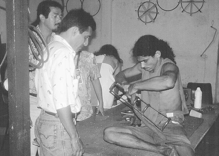 Later the professionals realized that Juao had more metal-workin skills than they did. So they asked Juao to take the lead in making his own brace, which he did proudly.