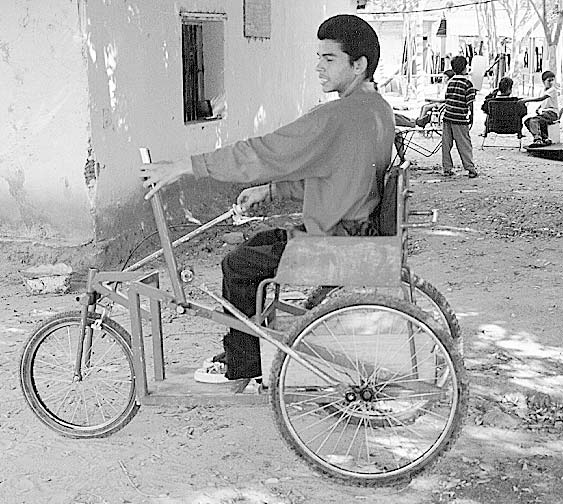 After Alejandro's sores healed, the PROJIMO wheelchair builders made him a hand-powered tricycle so that he could begin to travel across town to go to school. Alejandro helped to make his tricycle, and learned to repair it. (For more about Alejandro, see our new book Nothing About Us Without Us, chapters 31 and 40.)