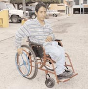 Figure 1 - The one-hand-drive wheelchair has handrims for both wheels on one side.