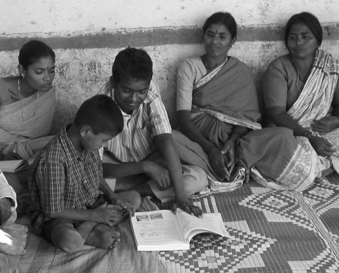 Ram (boy on right) and another boy were fascinated by the "Playground for All" pictures in Nothing About Us Without Us.