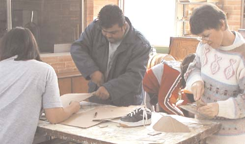 The group worked hard all afternoon, making the adaptations with wood, cloth, and laminated cardboard. Both Daniel’s parents helped with the work.