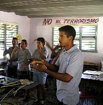 Inside the workshop for the deaf in Bartolomé Maso, the "No to Terrorism" sign refers not so much to acts by Al Queda, as to acts by the US government.