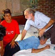 Here David Werner instructs Maritza in the exercises to help straighten Salvador’s hips.