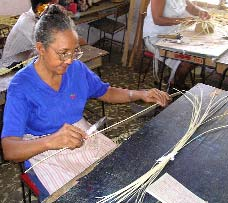 In the sheltered workshop in Bartolomé Maso, deaf persons are recovering a traditional craft of making baskets and sombreros from thin flexible strips of wood they cut from a vine that grows in the Sierra Maestra. Cuba is increasingly focusing on reviving traditional arts, as well as indigenous medicinal plants.