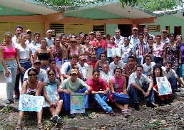 One form of "sensibilización" or disability awareness raising is through posters like these, held by CBR Activistas and program leaders at a meeting in Guisa, held at the primary school.