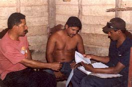 Wilberto (on left) walks 20 km. each way round trip into the mountains every 2 weeks to visit this man, whom he has helped learn to walk again after his leg was injured in an accident two years before.