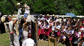 For scenes that take place further from the family house in the puppet show, smaller puppets are used.