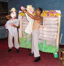 A practice session of a puppet show about a disabled boy who makes good, put on by a troupe—sponsored by the CBR project—that plans to take the show from village to village in the Sierra Maestra. The boy, Juan (left) has an amputated arm.