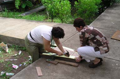 Using old cardboard cartons to make a standing frame. Cardboard is easier on the knees than wood.