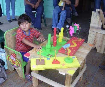 For Jeffree, his group made a seat with a table, and variety of early stimulation toys. Both parents helped with the work.