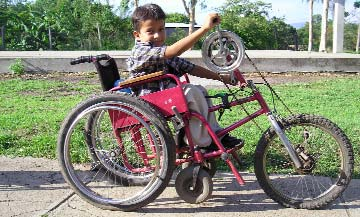 Joarling on his hand-powered tricycle.