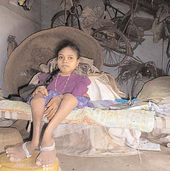 Parvathana has brittle bone disease. She can’t use the tricycle, now hanging unused, gathering dust. In the workshop, mediators made her a special seat and table where she can eat and draw.