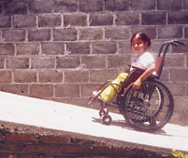 So with help from the family and community they built a ramp so the girl can get in and out of her home more easily.