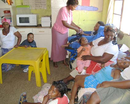 In some of these home-based day-car centers, several mothers help take care of the group of children.