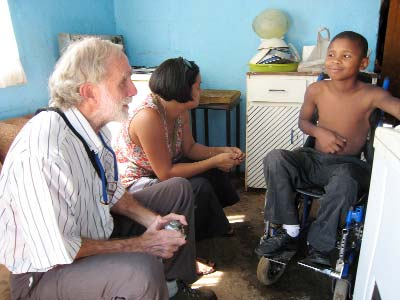 David Werner and a social worker visit Archie in his home.