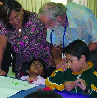 Yonathan (right) creates a ball of clay.