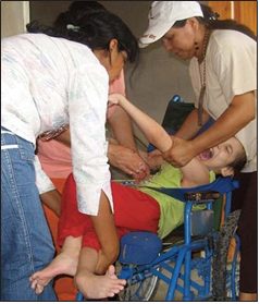 Mauricio howled with discomfort when the mediators tried to seat him in his oversized wheelchair.