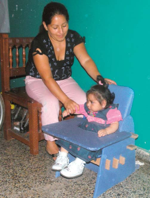 In the final plenary, Leysi’s mother proudly shows how her child sits in her elegant new seat.