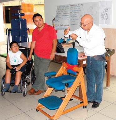 At the opening plenary Jorge’s uncle explains the therapeutic features of the unique seat he had built for his nephew.