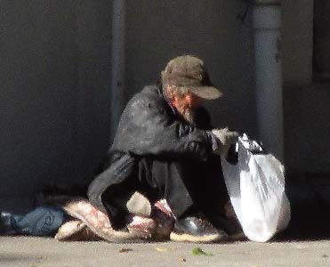 The ‘rough sleeper’ who was run off by the park guard found a new resting spot under an overpass.