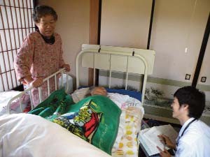 A doctor from the farm workers community hospital in Saku visits the home of a 93 year old woman, who is cared for round the clock by her aging daughter.