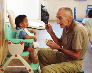 Visitors to Hijos de la Luna fall into the communal spirit and find joy in helping out where they can. Here my friend Peter Morris, who introduced me to Hijos de la Luna, helps feed an infant.