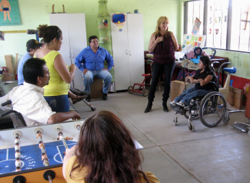 At a meeting in PROJIMO Coyotitan, Rigo (on left), Professor Mario and his partner Susana (center), and Virginia (on right) discuss group dynamics.