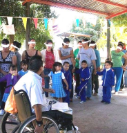 Rigo leads a workshop in which people without disabilities learn something about what it might be like to be blind.