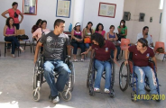 University students try their skill at managing wheel chairs.