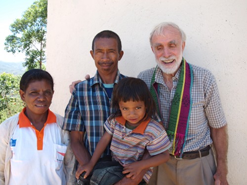 David with a former guerrilla—now a Family Health Promoter—with his wife and son.