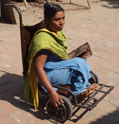 A woman in a wheelchair.