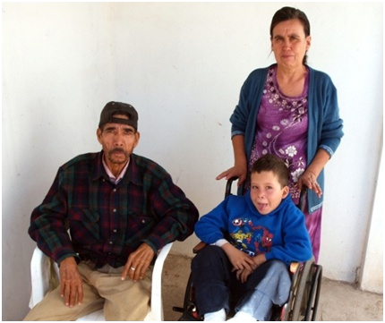 Miguel with his grandmother and grandfather.