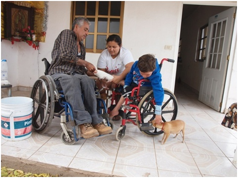 But sometimes the boy's attention turns elsewhere. Here he turns to play with the dog.