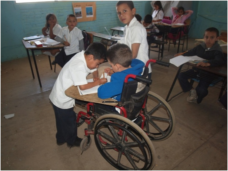 Because Miguel Angel started school half way through the year, and is behind in learning to read and write, his classmates eagerly help teach him.