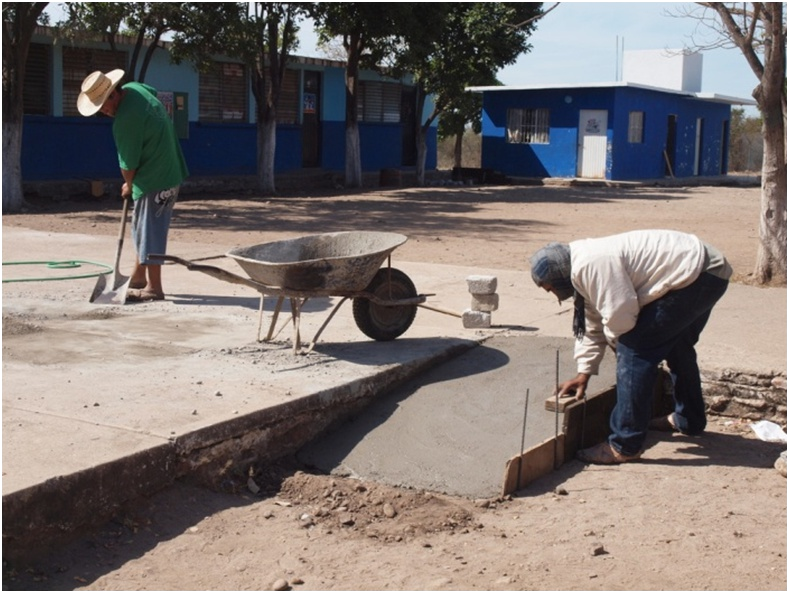 The school provided cement and other materials, and parents, teachers and older pupils provided the labor.