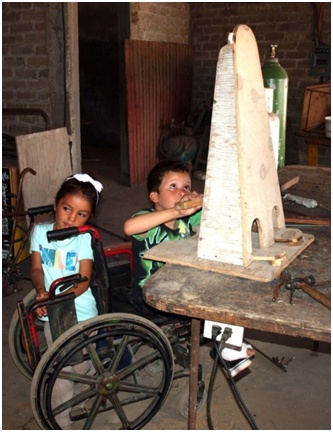 ...while his niece helps stabilize his wheelchair.