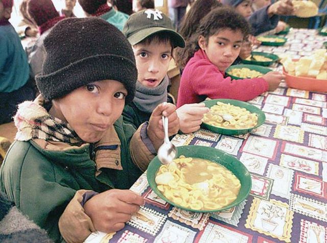 Hungry children at government sponsored food kitchen 