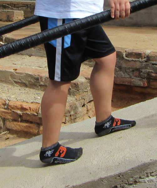 Walking up ramp helps stretch his tight heel-cords, which may allow the boy to keep walking longer.