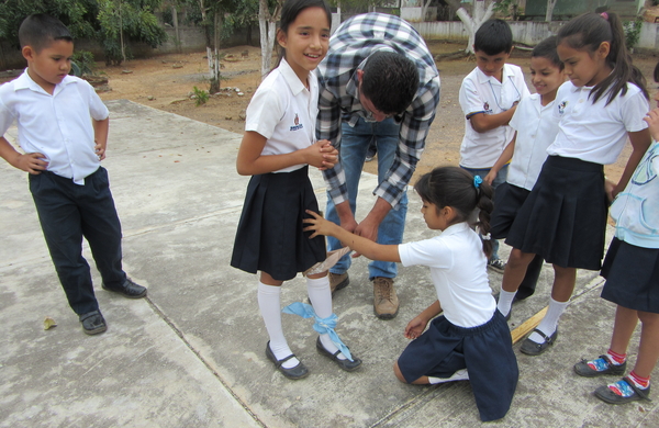 In the simulation games the children took turns having a stick tied to their leg to give them a limp.