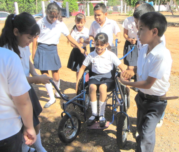 All the children were eager to try out riding and pushing Tonio's new spider-mobile.