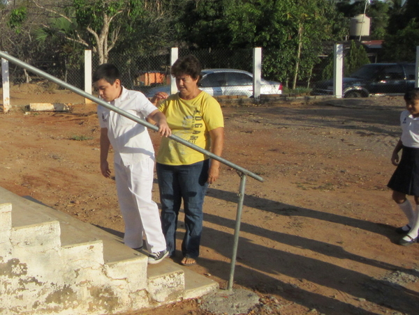 A few days later, as his concerned grandmother stood by, with the help of the new handrail Tonio succeeded in climbing the stairs independently.