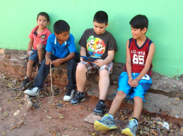 School-kids befriending Tonio on the day when railings being built.