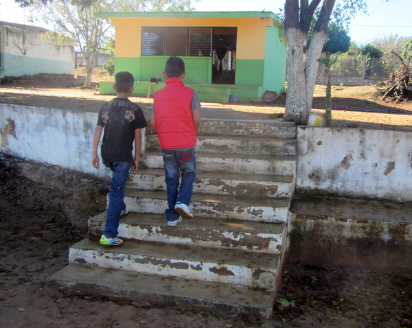 The first, lower set of steps to reach the schoolhouse.