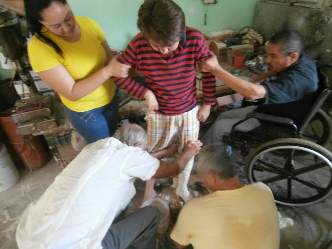 PROJIMO team taking a cast for the mold of Tomás AFO.