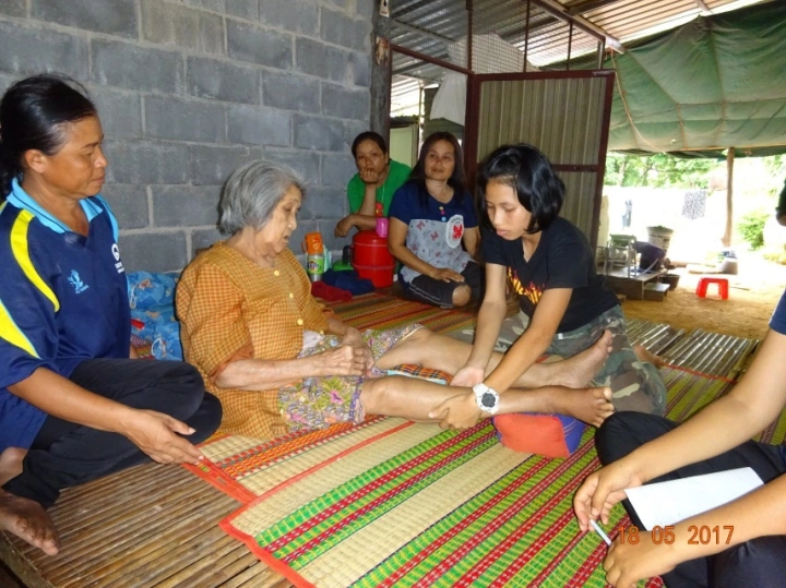 This older woman with kidney disease secondary to diabetes had leg cramps, and appreciated the gentle massages given by her young buddy.