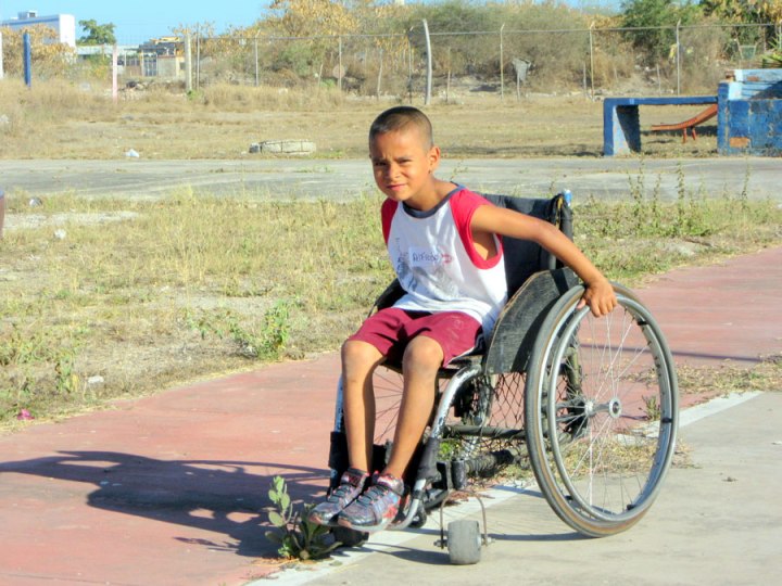The children are also given a chance to wheel around in wheelchairs.