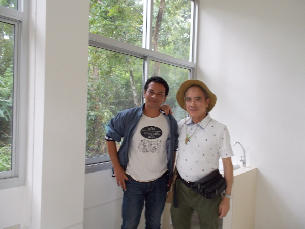 Dr. Toru Honda (on right) on his recent visit to Thailand (Aug 16, 2018) stands with Thom, a HSF staff-member, in the new Health and Share building in Khemarat. A gifted educator and activist, Thom helped lead the Buddy Home Care workshop and role-play we describe in this newsletter.