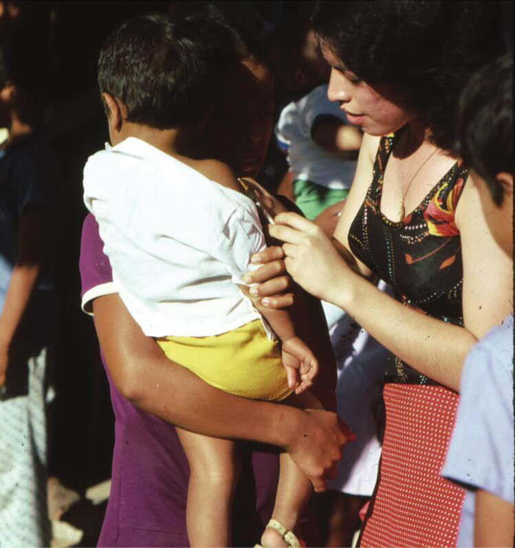 A village health promoter in Mexico’s Sierra Madre immunizes a child with DPT, a vaccine against diptheria, pertussus (whooping cough), and tetanus.